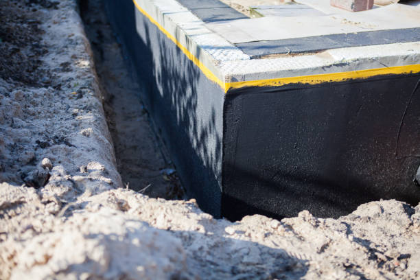 Professional Waterproofing technician working in Rio, VA